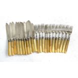 A set of plated and bone handled fish knives and forks for 12 place settings (1 knife missing and