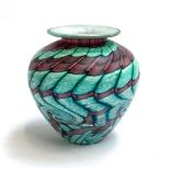 An Isle of Wight Glass vase by Michael Harris, swirling pink and green design, 11cmH