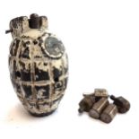 An antique inert grenade, 10cmH ; together with a quantity of brass die