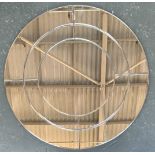 A contemporary circular wall mirror of 9 bevelled panels, 90cmD