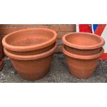 Two pairs of terracotta plant pots, 43cmD and 34cmD