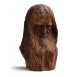 A carved wooden bust of Leonardo da Vinci, signed Le Serrec, 47cm high