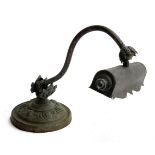 An early 20th century bronze lamp with chased rococo scroll decoration