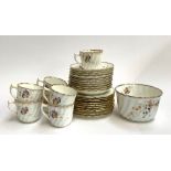 A china tea set with floral decoration comprising cake plates (2), side plates (10), saucers (11),