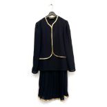 A Gina Bacconi three piece suit with gold edging and pleated skirt, approx. size 10, together with a