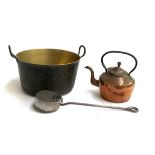 A large brass pan, 33.5cmD with iron handles, together with a copper kettle and one other item