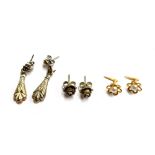 Three pairs of earrings to include white metal roses, 9ct gold and pearl, and one other pair