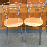 A pair of Italian designer chairs, bent ply seats and frosted metal frames