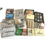 A large quantity of cigarette, tea cards and silks to include Ogdens, Wills, Players, Kensitas
