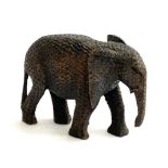 A small wicker basket, 37cmW, a Christmas Angel, and a carved wooden elephant, 12cmH