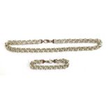 A heavy 925 silver chain, hallmarked JM, can be worn as a long necklace, 65cm long, or a shorter