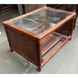 A bamboo and glass topped coffee table, 82x57x47cm