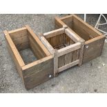 A square wooden garden planter, 33cm2; together with two others