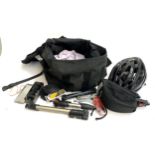 A mixed lot of bicycle related kit to include several pumps, helmet, tyre repair kit, lights etc
