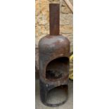 A steel outdoor chiminea