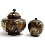 Two Japanese Meiji era cloisonne goldstone enamel lidded pots, decorated with butterflies, the