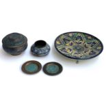 An Middle Eastern enamelled copper bowl and cover, further enamel items and a Moroccan glazed plate,