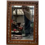 A wicker framed rectangular wall mirror, 85x62cm