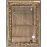 A gilt gesso framed rectangular wall mirror with bevelled glass, 71x51cm