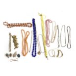 A quantity of costume jewellery, to include gold tone chains, beads, brooches etc