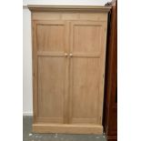 A pine hanging wardrobe, dentil cornice over two doors, 114x47x190cmH