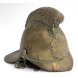 A Victorian Merryweather Pattern brass fire brigade helmet, the comb embossed with dragons to
