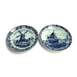 Two Delft chargers depicting a windmill and boat at sea, marked Blauw Chemkefa, made in Holland,