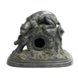 A heavy bronze mantel clock case surmounted by a crouching panther on a naturalistic base, 30x39cm