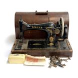 A singer sewing machine, serial no. Y1723545 with some accessories, in a hooped carry case (key