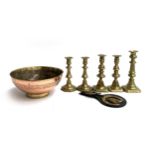 Two pairs of brass candlesticks, together with one other; a horse brass; and a copper and brass rose