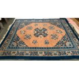 A Chinese wool rug with central medallion, 292x250cm