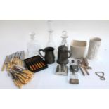 A mixed lot to include 3 glass decanters, vases, pewter tankards, hip flask, walnut cracker,