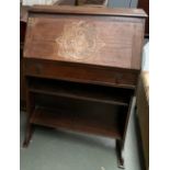 An oak student bureau, 76cmW, together with a 19th century low armchair with serpentine seat and
