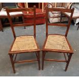 A pair of Edwardian mahogany and marquetry strung occasional chairs, with caned seats