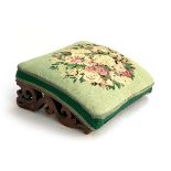 A small Victorian footstool, gorspoint upholstered top on pierced supports