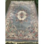 A Chinese wool rug, 265x180cm, together with a further one of similar size