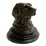 A bronze inkwell in the form of a hound with hinged cover on turned plinth base, 11cmH