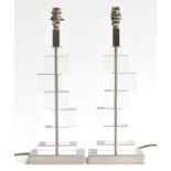A pair of lucite and brushed steel table lamps by Aminta, 45cm high