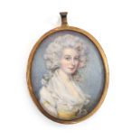 A late 18th/early 19th century French miniature on ivory of a lady, in a gilt metal frame, 7x5.5cm