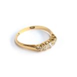 An 18ct gold ring set with five graduated diamonds, size N, approx. 2g