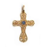 An 18ct gold pierced crucifix set with a central blue stone, 3.2cm long, 3g