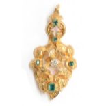 A mid Victorian gold pendant, tests as 14ct or higher, of scrolling open form engraved with