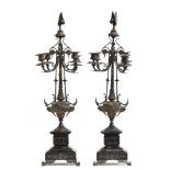 A pair of late 19th century ornate candlestick garnitures, remains of gilding to the five light