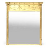 A large gilt gesso pier mirror, in the Adam style, pediment with applied bobble mouldings, over bell