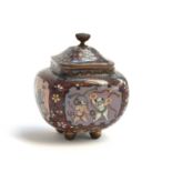 A Japanese Meiji era cloisonne enamel squat urn, the panels depicting butterflies and dancers, on
