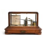 A late Victorian oak cased barograph, marked 'J Hicks, Maker, London', shallow drawer to base, on