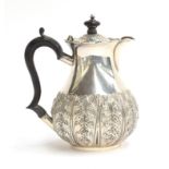 A late Victorian silver coffee pot by Josiah Williams & Co, London 1897, ebonised knop and handle,