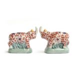 A pair of early 20th century Chinese imari style rhino figurines by YaYou Zhen Cang, each signed