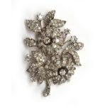 A French Belle Epoque diamond and platinum brooch in a floral form, set with approx. 184 diamonds,