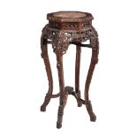 A Chinese carved hardwood and marble inset jardinière stand, 95cm high